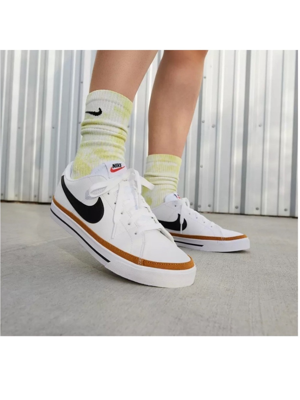 Nike Women's White Sneakers with Black Swoosh and Brown Accent